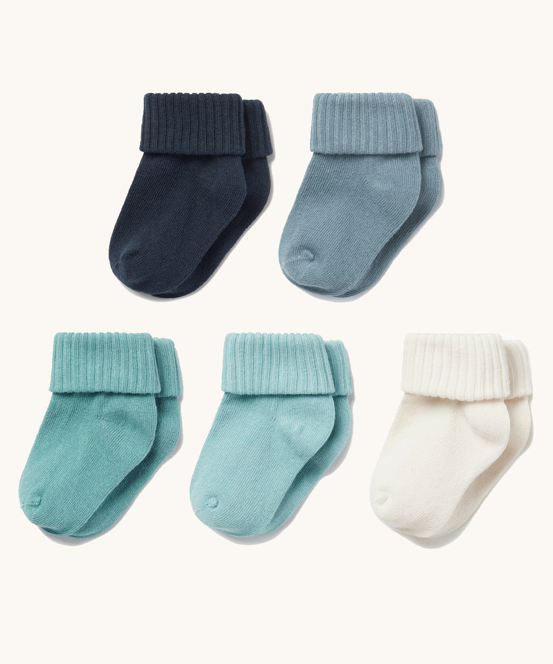 Five different shades of blue baby socks