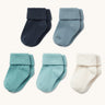 Five different shades of blue baby socks