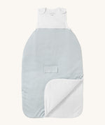 MORI baby sleeping bag in 1.5 TOG. A jersey style baby sleeping bag in white and grey stripe design on organic fabric. showing the zip up feature open for easy changing