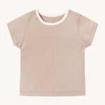 MORI short sleeve t-shirt in blush. A light pink ribbed style short sleeve top made from bamboo and organic cotton. Features poppers at the shoulder for easy fitting and a white neck trim