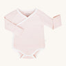 MORI baby kimono bodysuit. 100% organic cotton wrap-style front kimono in pink and white stripe with white trim. Features poppers at the crotch for easy fitting