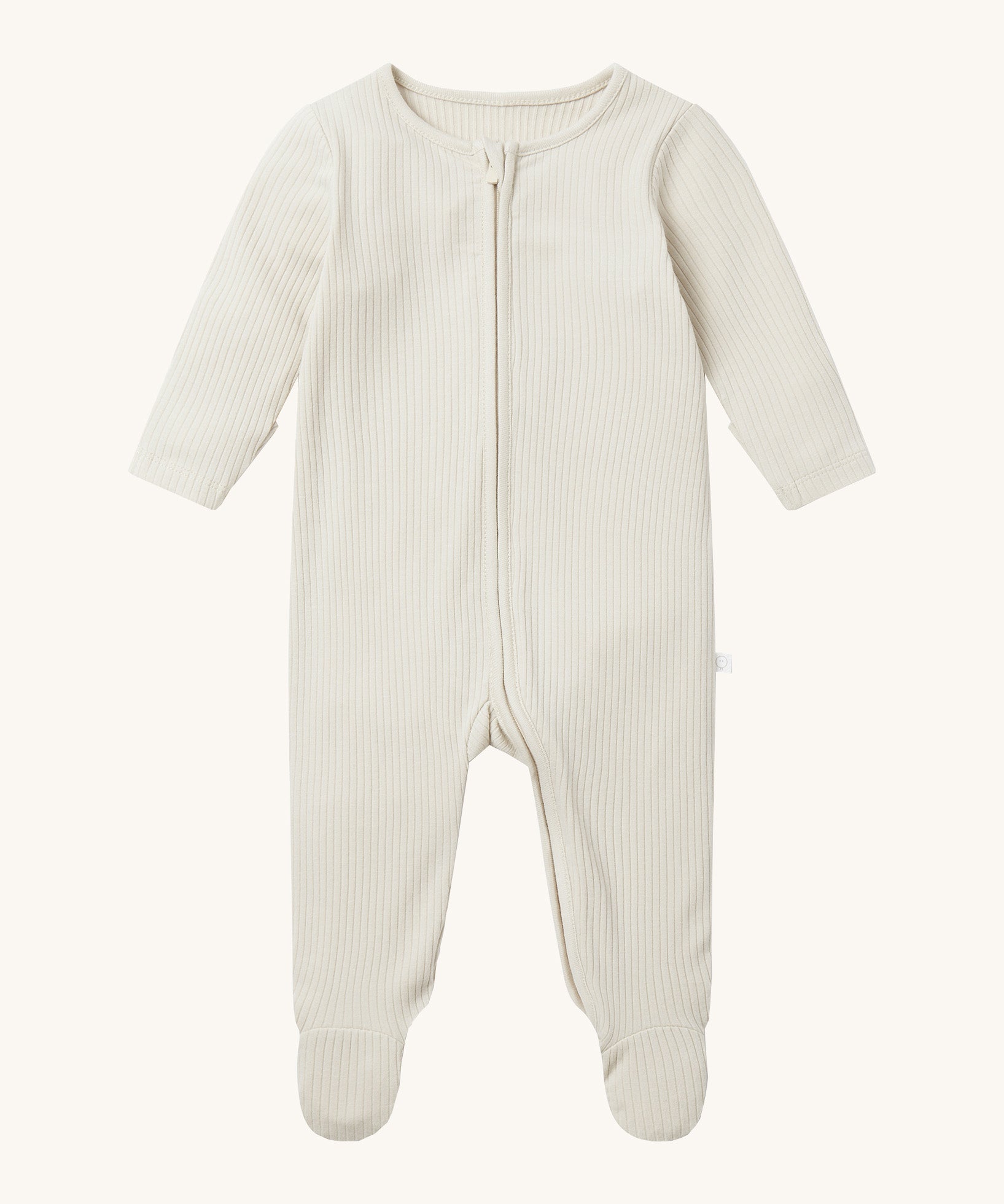 Mori two way zipped sleepsuit in ecru colour. A ribbed style all in one outfit made from bamboo and organic cotton. Features a two-way zip and concealed for safety