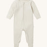 Mori two way zipped sleepsuit in ecru colour. A ribbed style all in one outfit made from bamboo and organic cotton. Features a two-way zip and concealed for safety