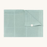 MORI cellular blanket in mint. A 100% organic fabric blanket in a light green colour with air hole to keep cool and warm on colder days. 