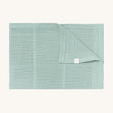 MORI cellular blanket in mint. A 100% organic fabric blanket in a light green colour with air hole to keep cool and warm on colder days. 