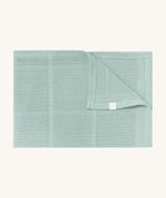 MORI cellular blanket in mint. A 100% organic fabric blanket in a light green colour with air hole to keep cool and warm on colder days. 