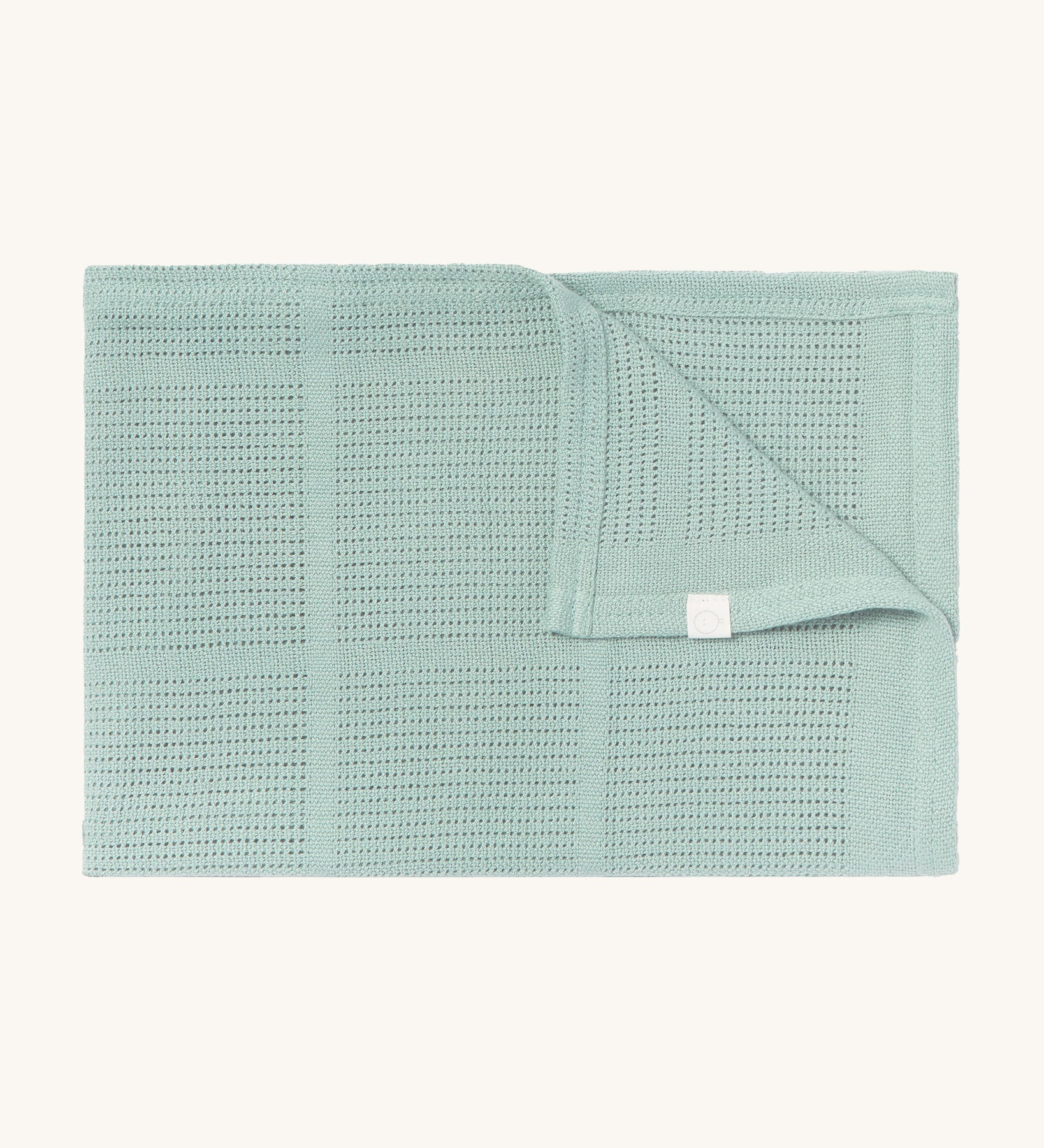 MORI cellular blanket in mint. A 100% organic fabric blanket in a light green colour with air hole to keep cool and warm on colder days. 