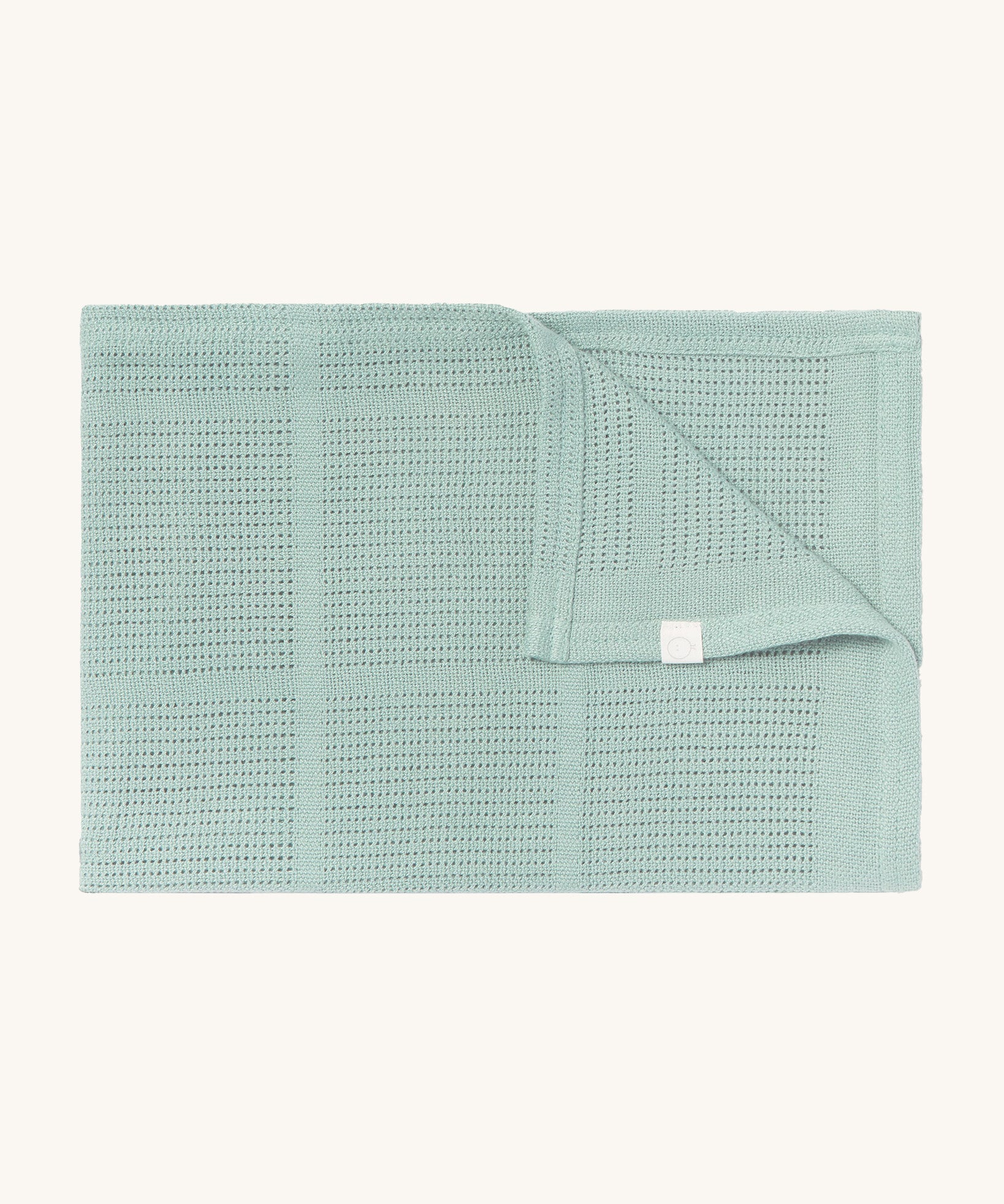 MORI cellular blanket in mint. A 100% organic fabric blanket in a light green colour with air hole to keep cool and warm on colder days. 