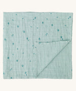 MORI muslin square in mint. 100% organic cotton muslin in light green with cute little prints of clouds and creatures in darker green