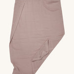 MORI cellular blanket in rose laid out showing the air hole detail on organic fabric. 