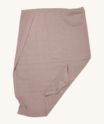 MORI cellular blanket in rose laid out showing the air hole detail on organic fabric. 