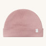 MORI hat in rose. A light pink ribbed style beanie made from bamboo and organic cotton. Features an soft turn up brim