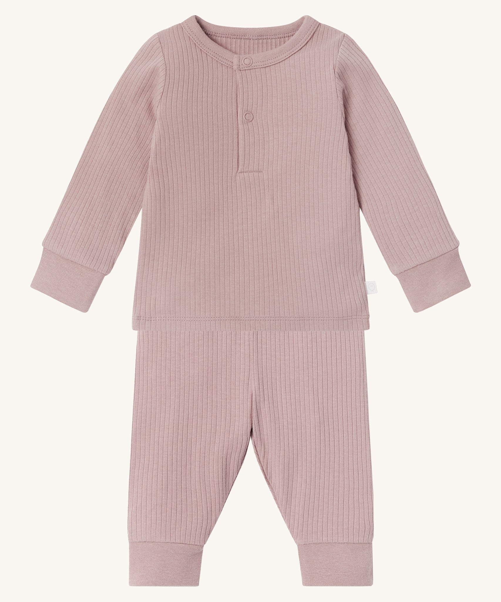 MORI pyjamas in rose. A light pink ribbed style pyjama set made from bamboo and organic cotton. Features a popper fastener top for easy fitting and elasticated cuffs on the arms and legs for a comfortable fit