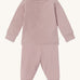 MORI pyjamas in rose. A light pink ribbed style pyjama set made from bamboo and organic cotton. Features a popper fastener top for easy fitting and elasticated cuffs on the arms and legs for a comfortable fit