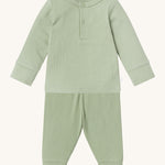 MORI pyjamas in sage. A light green ribbed style pyjama set made from bamboo and organic cotton. Features a popper fastener top for easy fitting and elasticated cuffs on the arms and legs for a comfortable fit