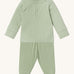 MORI pyjamas in sage. A light green ribbed style pyjama set made from bamboo and organic cotton. Features a popper fastener top for easy fitting and elasticated cuffs on the arms and legs for a comfortable fit
