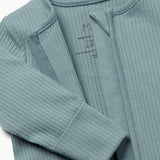 A close up of the concealed zip detail on the MORI two way sleepsuit in sky blue on organic fabric