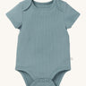 MORI short sleeve body suit in sky blue. A ribbed style bodysuit made from bamboo and organic cotton. Features 3 poppers at the crotch for easy fitting