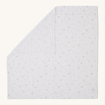 MORI muslin square in white laid out flat showing the cute little prints of clouds and creatures in dark grey on organic cotton fabric