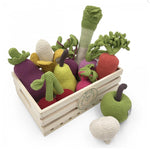 Myum eco-friendly wooden crate toy filled with myum crocheted vegetable soft toys on a white background