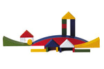 Naef Bauhaus building block set built into a village scene on a white background