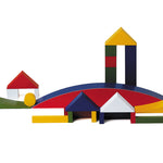 Naef Bauhaus building block set built into a village scene on a white background