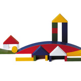 Naef Bauhaus building block set built into a village scene on a white background