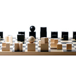 Naef premium wooden chess pieces on the Naef Bauhaus chess board on a white background