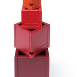 revealing the tiers of different sized cube pieces. Toy is placed on a white background.