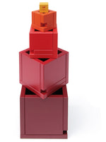 revealing the tiers of different sized cube pieces. Toy is placed on a white background.