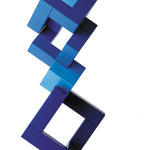 Naef Cubicus Blue stacked in a precarious tower on a white background with smallest cube pieces on the top and bottom.