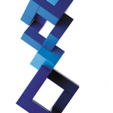Naef Cubicus Blue stacked in a precarious tower on a white background with smallest cube pieces on the top and bottom.