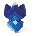 Naef Cubicus wooden construction toy stacked on a white background