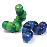 Blue and Green Naef Juba worm toy laying on a white background.