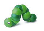 Green Naef Juba worm toy laying on a white background.