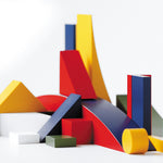 Close up of the Naef multicoloured wooden building toys on a white background