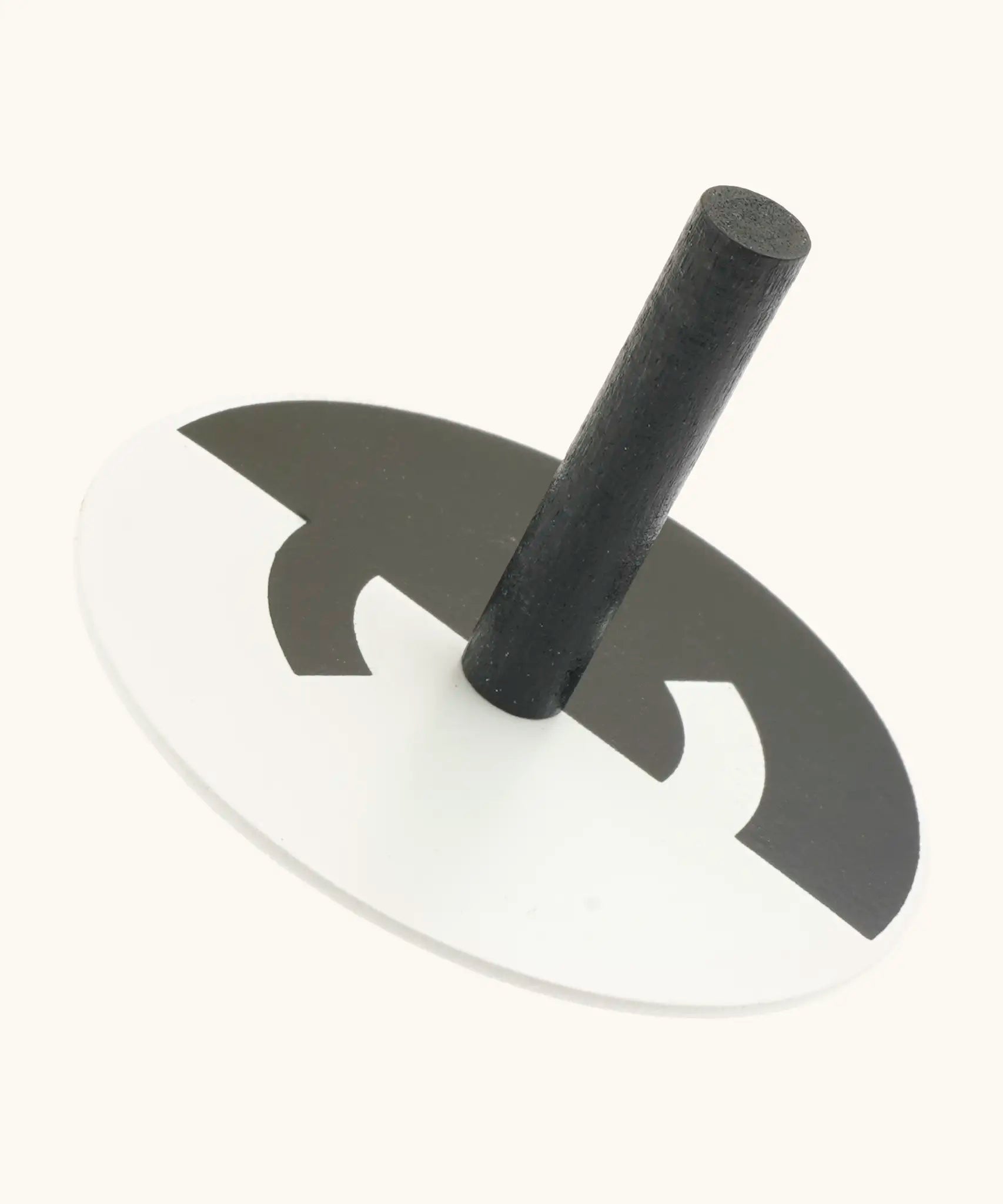 Naef handcrafted wooden spinning top in monochrome with a optical illusion