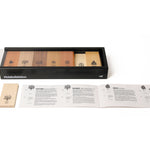 Naef premium wooden block set in its collector box on a white background