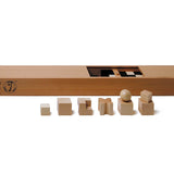 Pieces from the Naef eco-friendly wooden chess pieces set in front of their wooden storage box on a white background