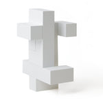 4 pieces of Naef's Quadrigo toy assembled to make a upright geometric shape.