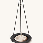 The Naef sand pendulum, a mathematical executive toy creating patterns in the sand.