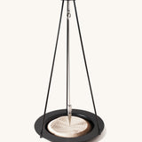 The Naef sand pendulum, a mathematical executive toy creating patterns in the sand.