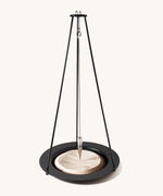 The Naef sand pendulum, a mathematical executive toy creating patterns in the sand.