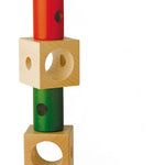 Naef Signa wooden threading toy stacked on a white background in an intermittent pattern.