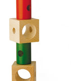 Naef Signa wooden threading toy stacked on a white background in an intermittent pattern.