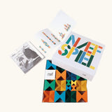 Naef spiel special 100 year edition spiel block set shown in their box with booklet. Tribute to Kurt Naef on the 100th anniversary of the founder's birth featuring a 60's inspired colour pallete. 