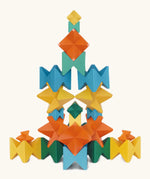 Naef spiel special 100 year edition spiel block set shown stacked into a tower link structure. Tribute to Kurt Naef on the 100th anniversary of the founder's birth featuring a 60's inspired colour pallete. 