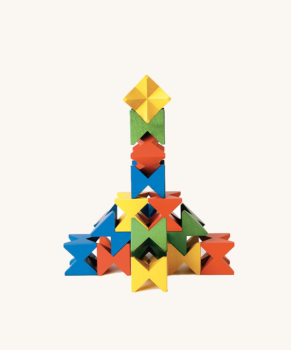 Complex vertical tower built with Naef Spiel Mini interlocking coloured blocks. German made wooden construction toy combining art, design, and precision play.