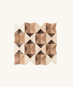 The Naef Spiel Mini in natural, laid out in a square formation and highlighting the natural grain of the hand cut maple wood. 