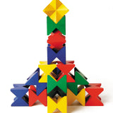 Naef Spiel wooden construction blocks stacked in a geometric tower on a white background